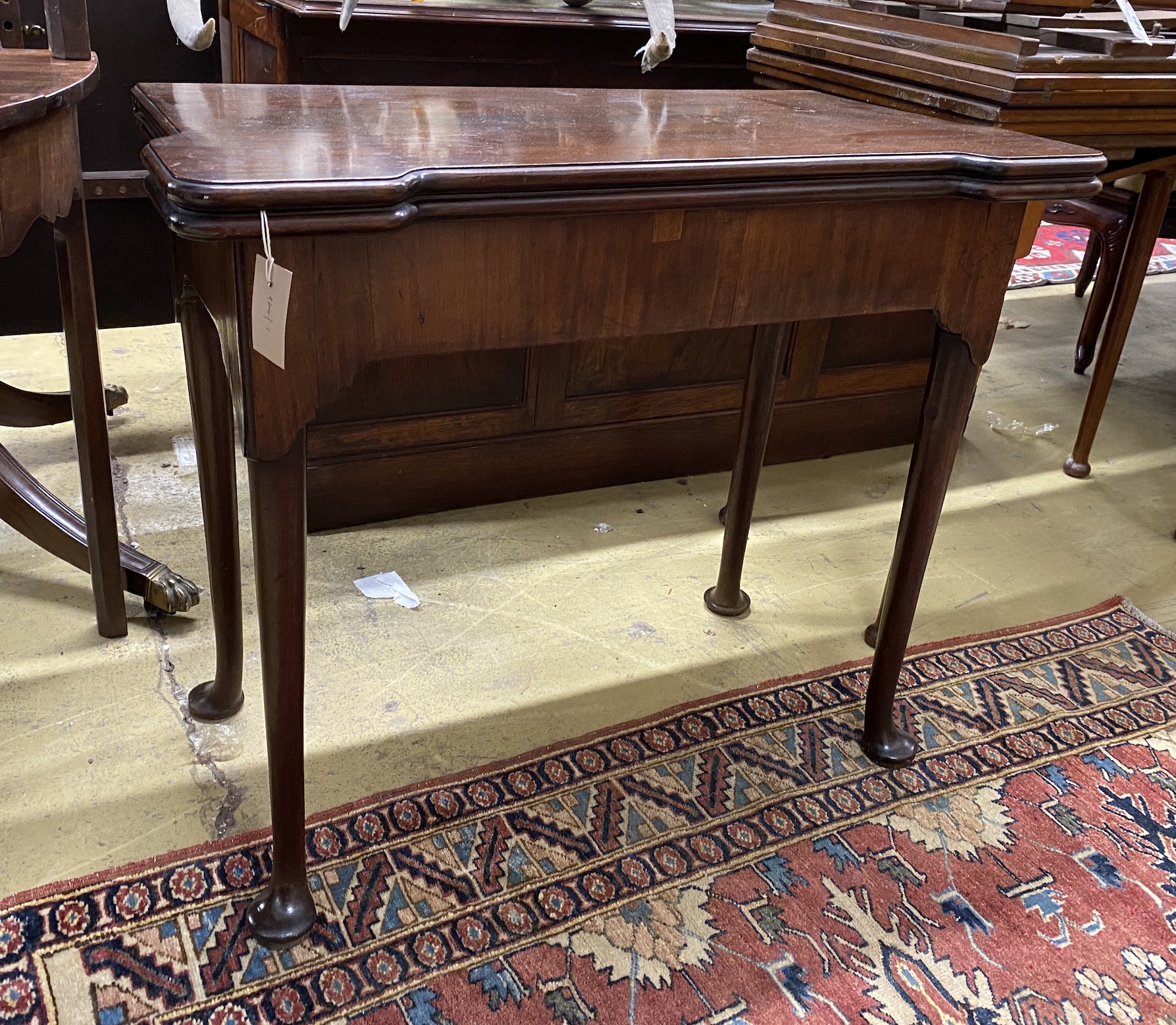 A George III rectangular mahogany folding card table, width 84cm, depth 42cm, height 71cm